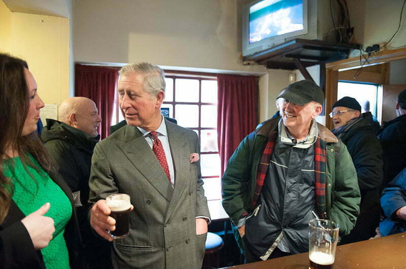 Prince Charles enjoys a beer in Toxteth, Liverpool.
