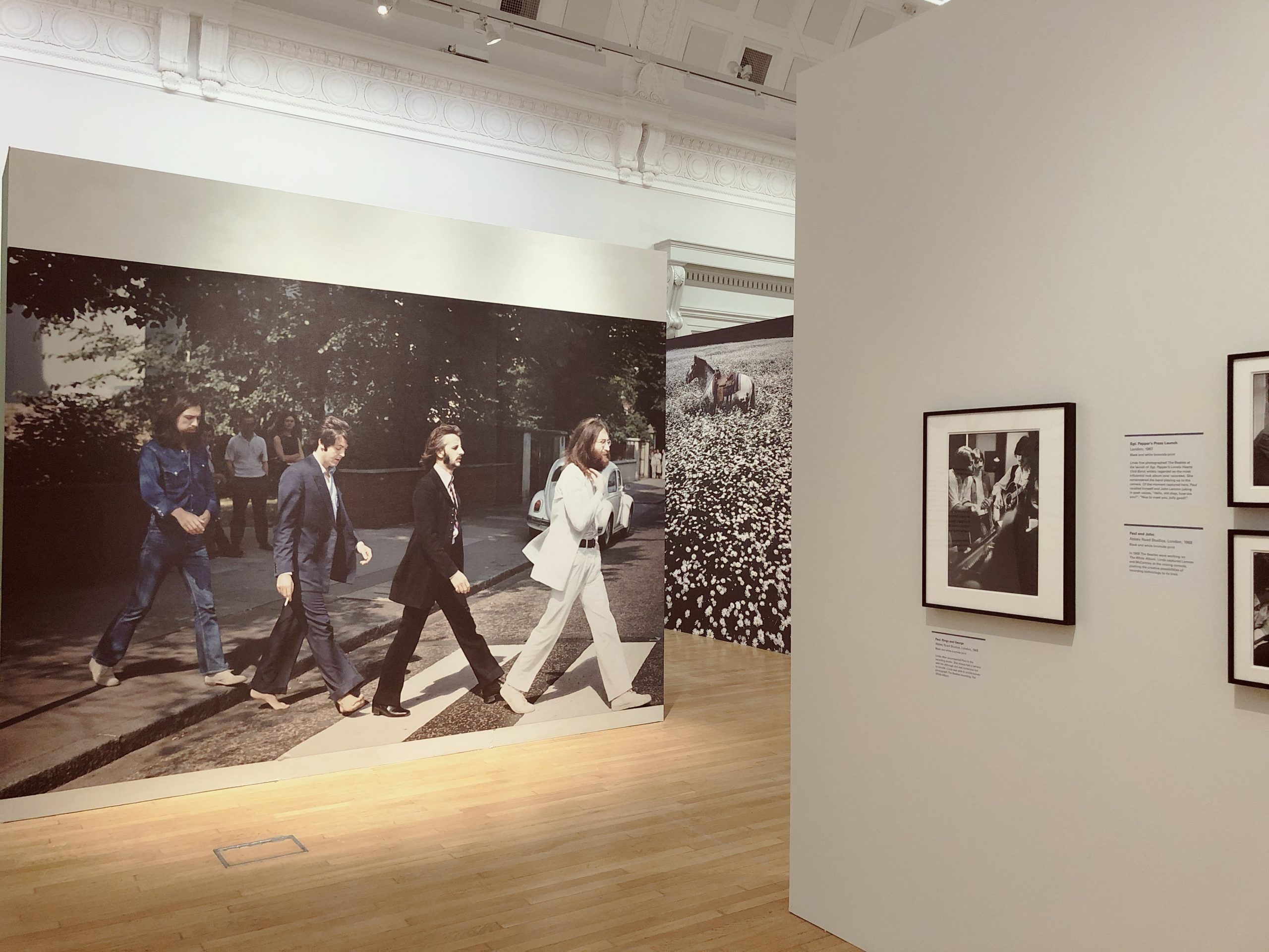 Photos of the Beatles hanging in a museum