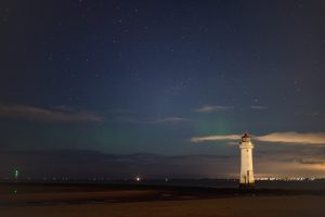 Feint hints of the aurora by New Brighton Lighthouse at night.