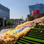 A giant sea of colourful foam floods down a large set of steps outside John Lewis in Liverpool.